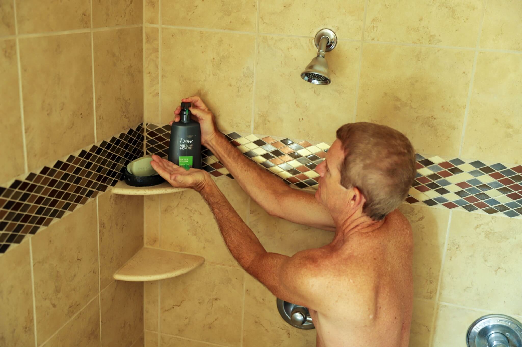 man using dove men's care products from sam's club