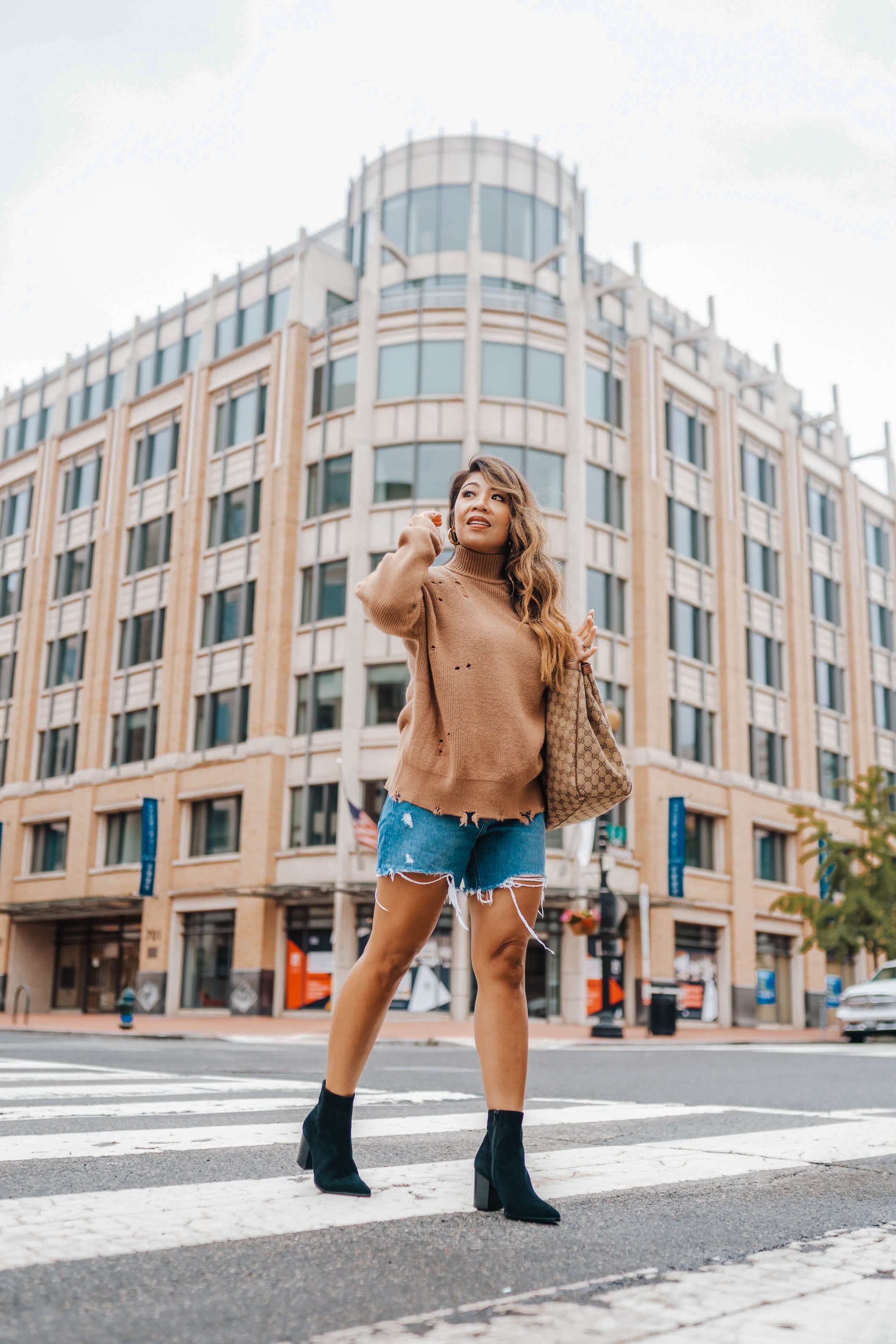woman wearing a Lovers + Friends Arlington Sweater from Revolve