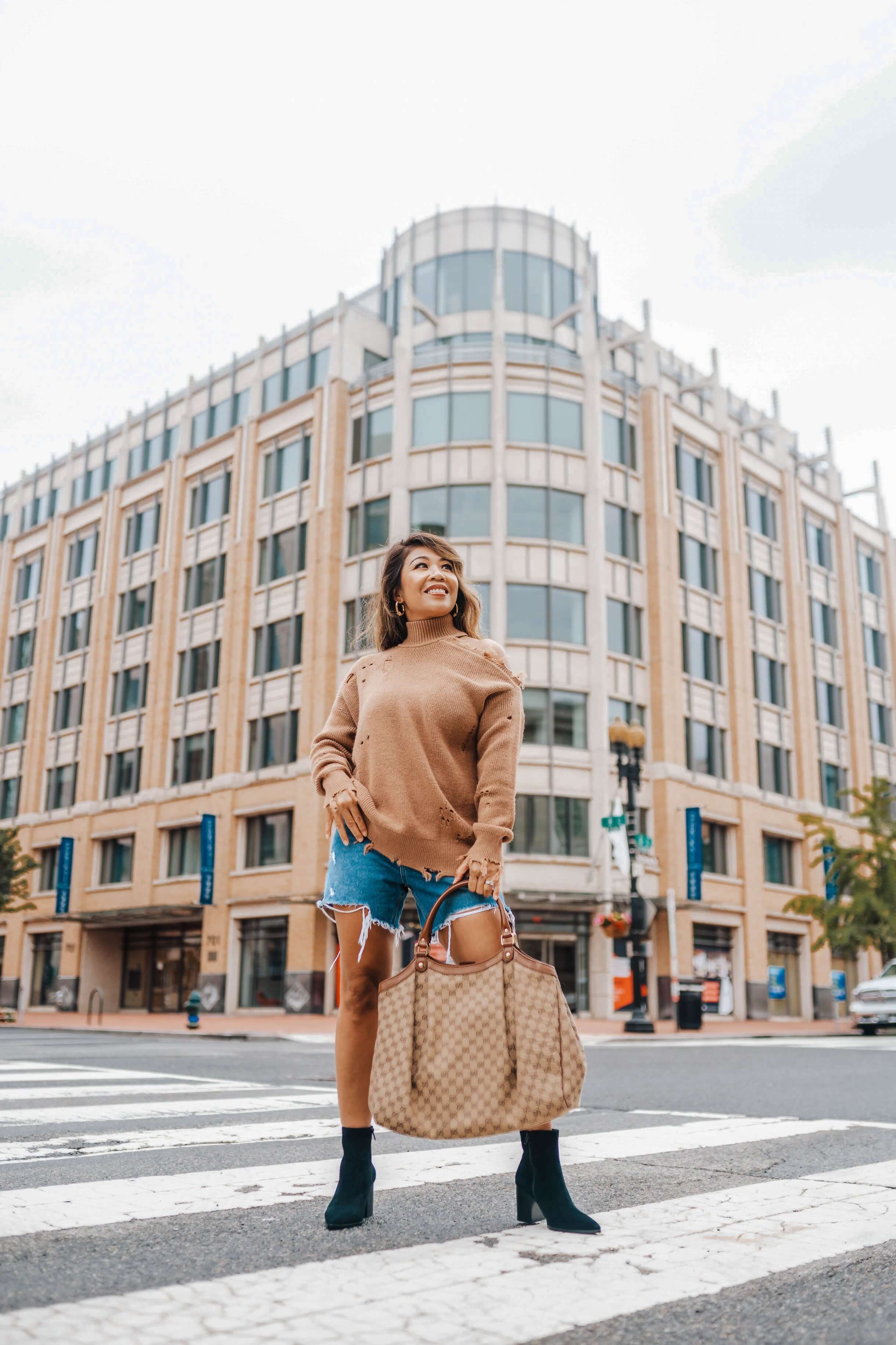 woman wearing a Lovers + Friends Arlington Sweater from Revolve