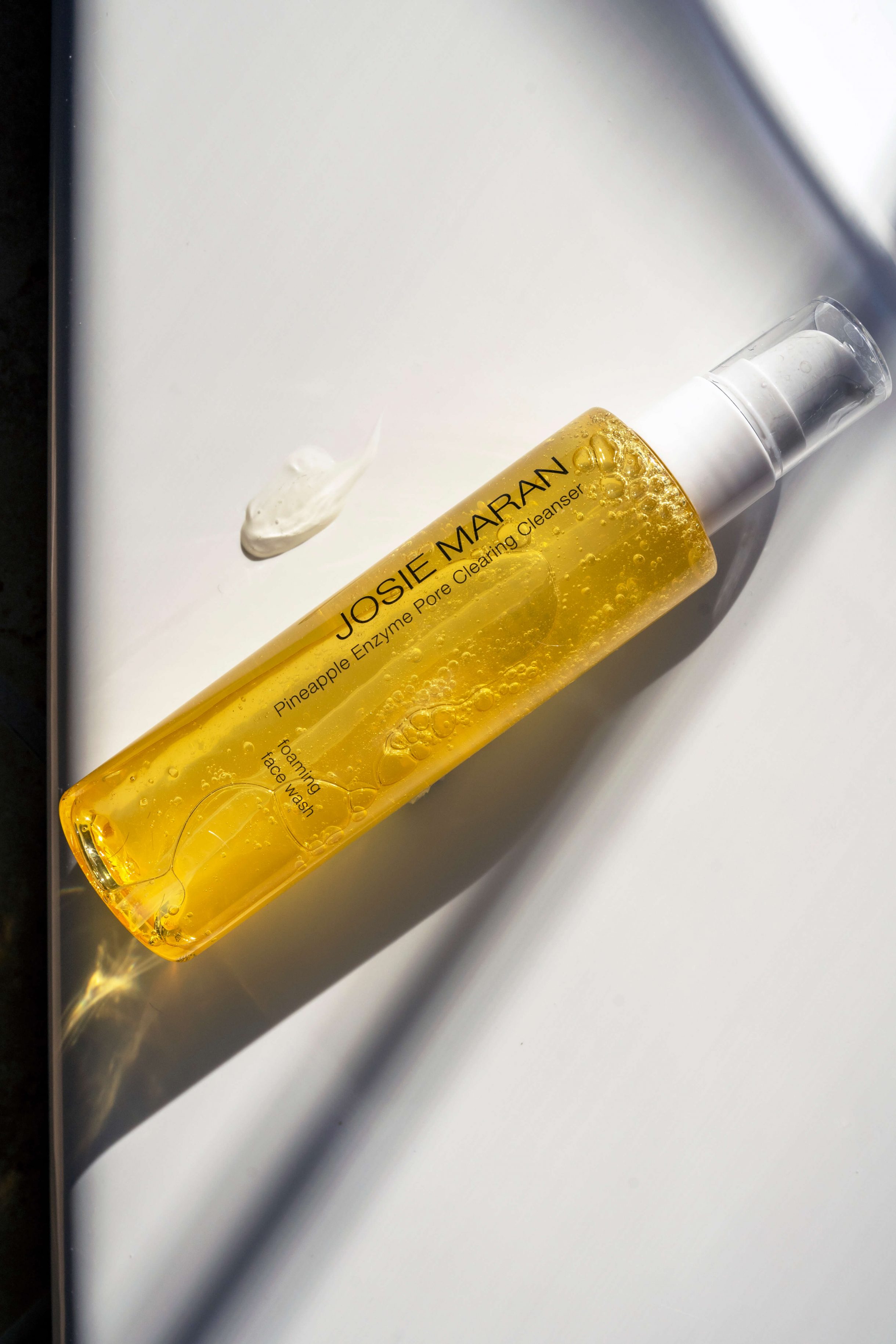Showing a bottle of Josie Maran Pineapple Enzyme Pore Clearing Cleanser