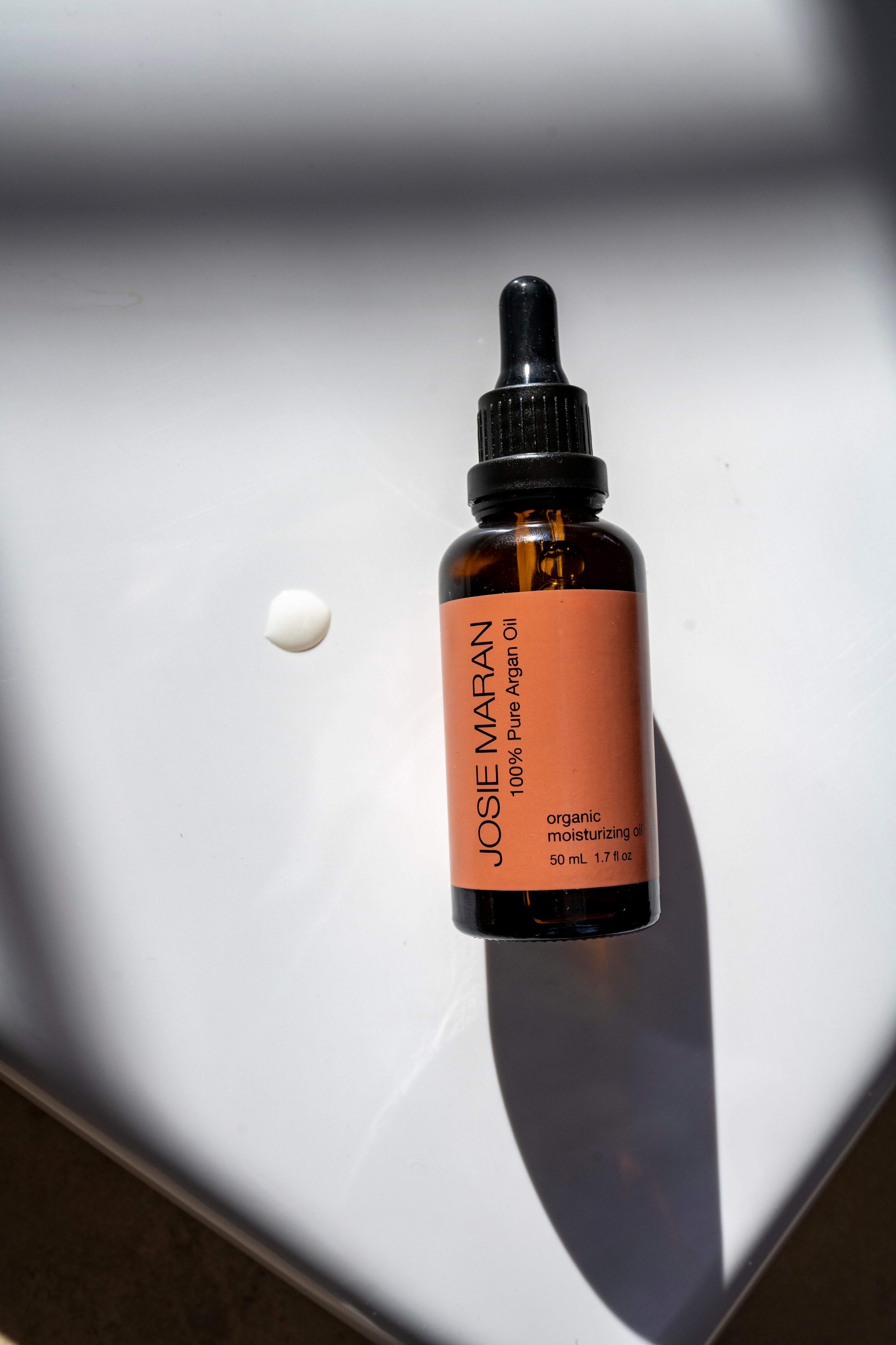 Showing a bottle of Josie Maran Pure Argan Oil
