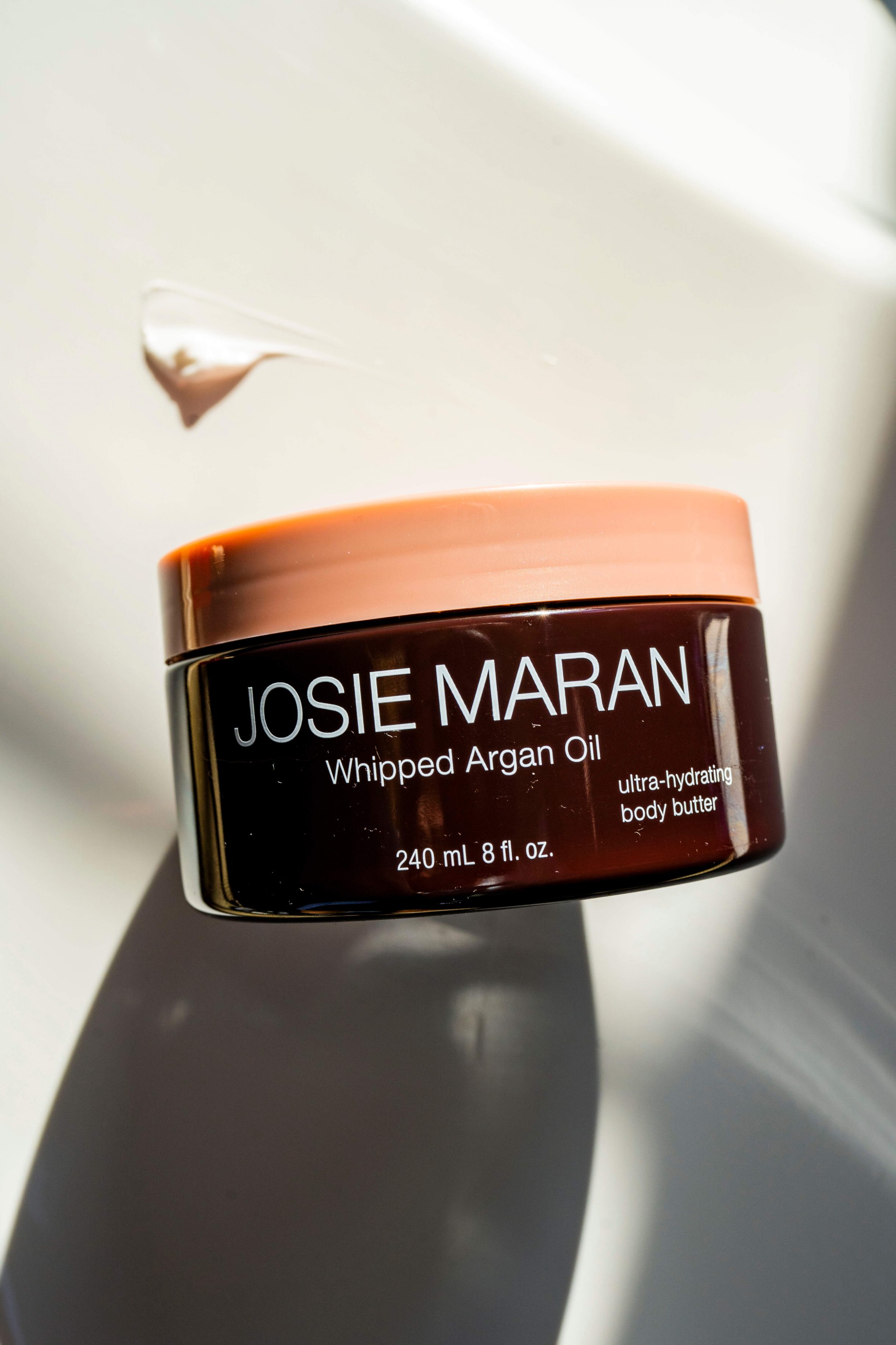 Showing a container of Josie Maran Whipped Argan Oil Body Butter